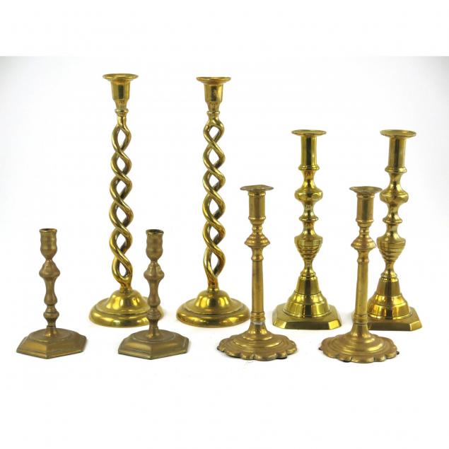 four-pairs-of-antique-brass-candlesticks