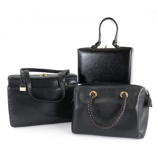 three-vintage-black-leather-handbags