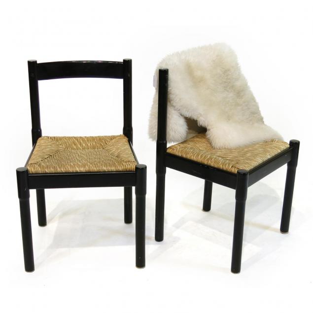 pair-of-italian-modern-chairs-and-sheepskin-rug