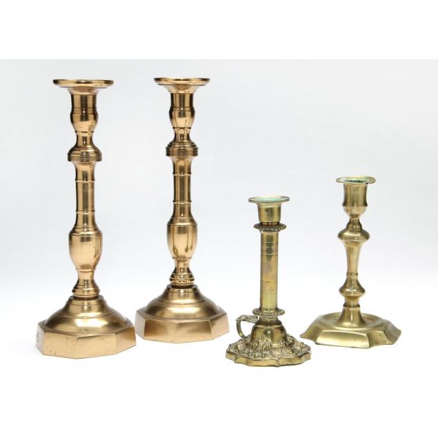 four-antique-brass-candlesticks