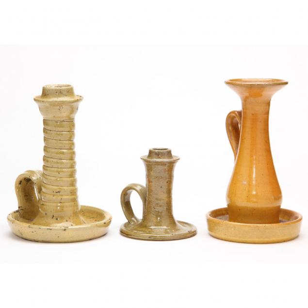 three-early-nc-pottery-chambersticks