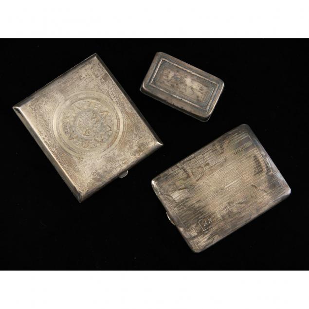 three-silver-cases