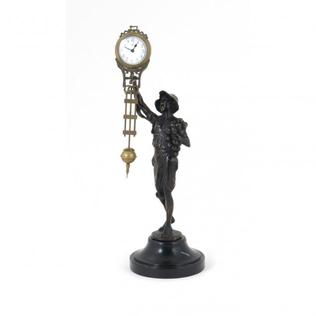 continental-patinated-metal-swinger-clock