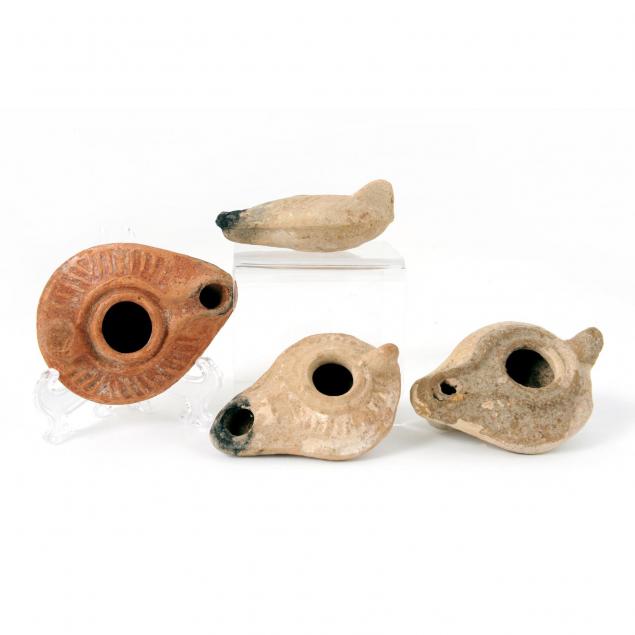 four-ancient-terracotta-oil-lamps