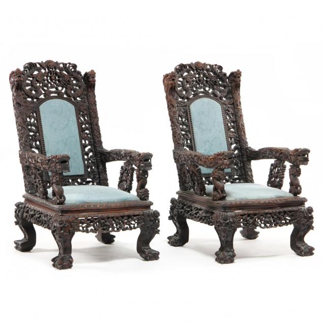 pair-of-heavily-carved-asian-great-chairs