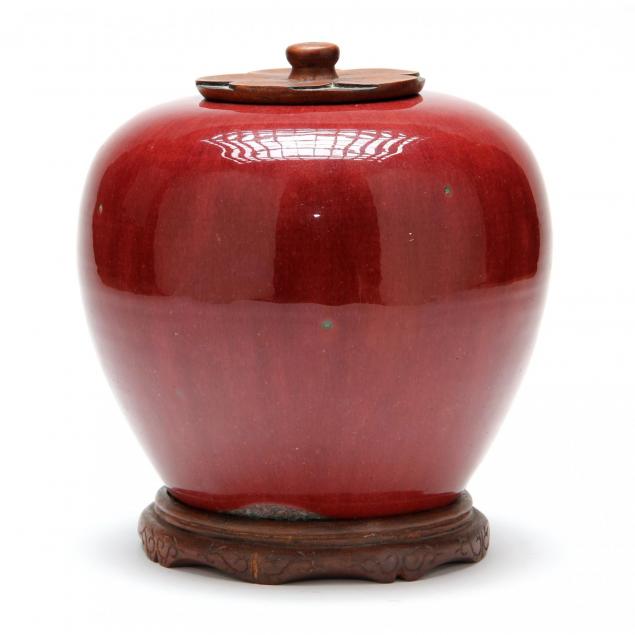 chinese-oxblood-sang-de-boeuf-jar-with-carved-wooden-lid
