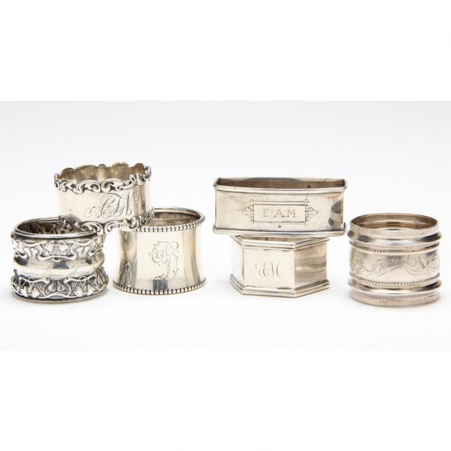 an-assembled-set-of-six-silver-napkin-rings