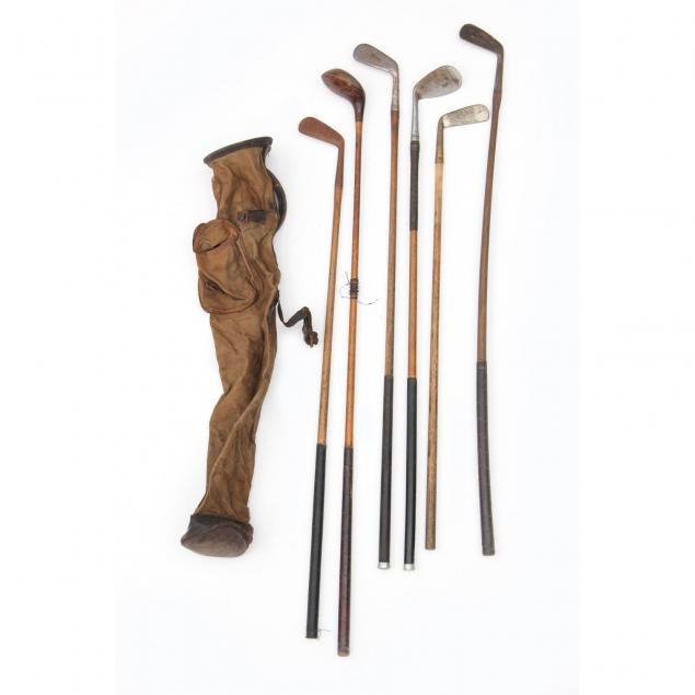 six-antique-wood-handled-golf-clubs-and-bag