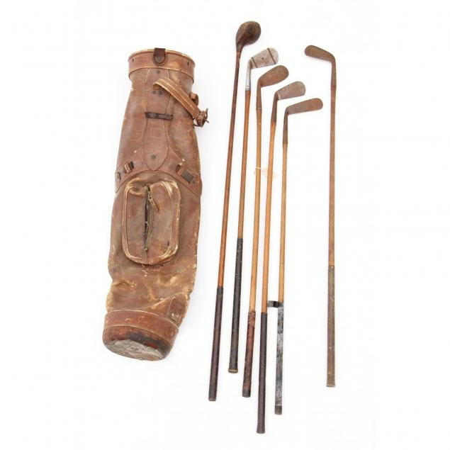 six-antique-wood-handled-golf-clubs-and-bag