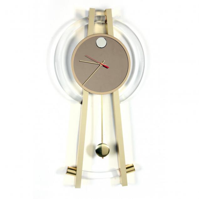 modernist-lucite-and-brass-compass-form-wall-clock