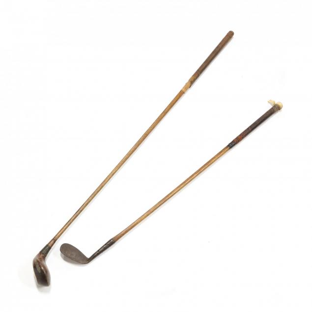 two-antique-golf-clubs