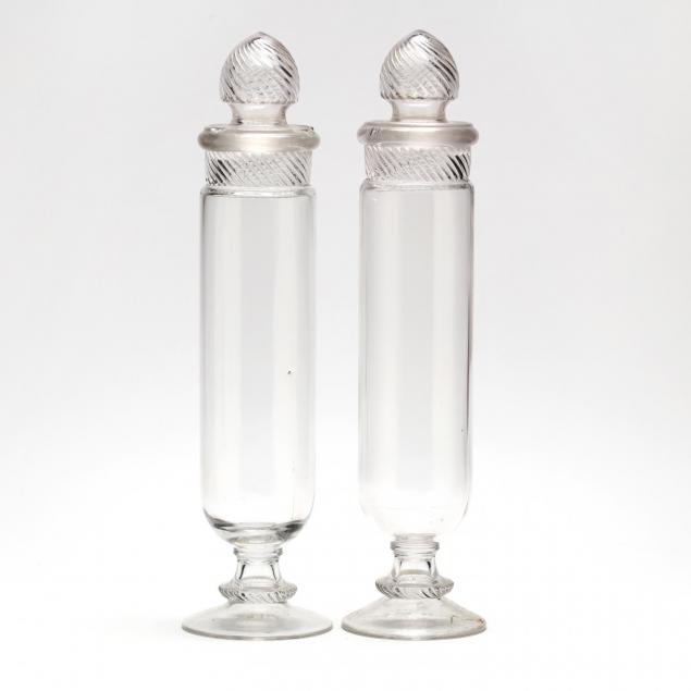 a-pair-of-tall-clear-glass-apothecaries