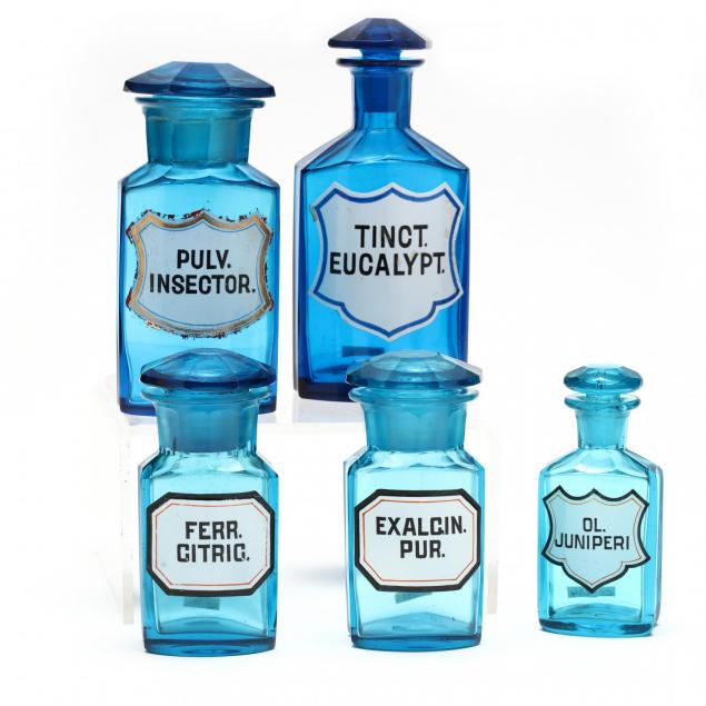 five-turquoise-blue-drug-bottles