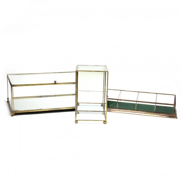 three-brass-and-glass-display-cases
