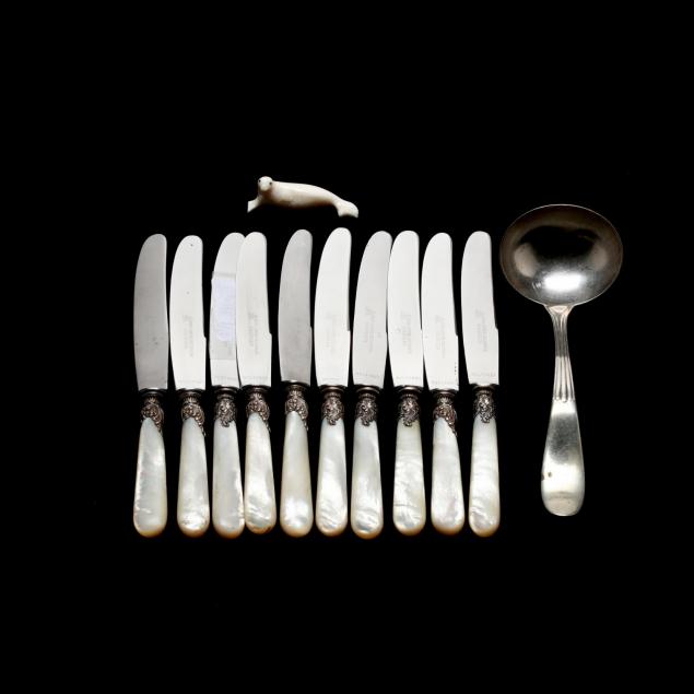 group-of-silver-mother-of-pearl-flatware