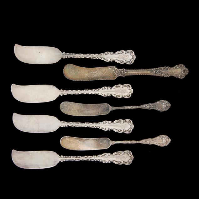 an-assembed-set-of-7-sterling-silver-butter-knives