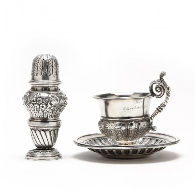 an-antique-italian-silver-caster-and-teacup-saucer