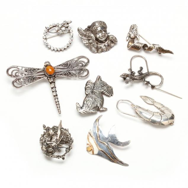 nine-silver-brooches