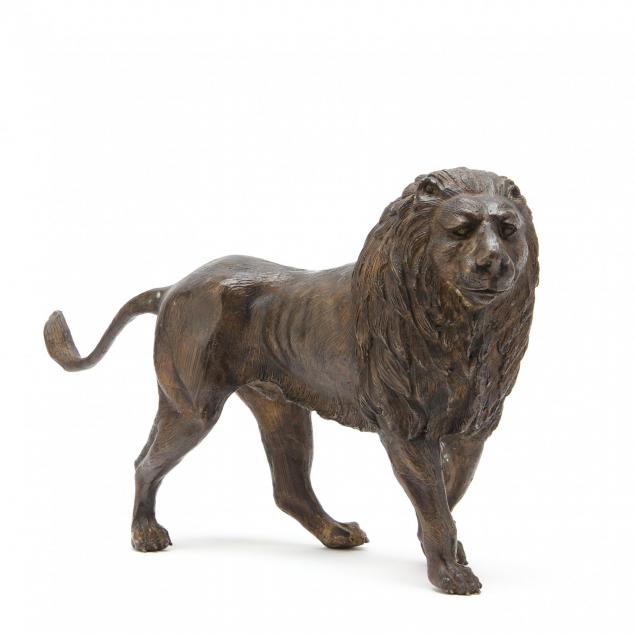 bronze-tone-sculpture-of-a-lion