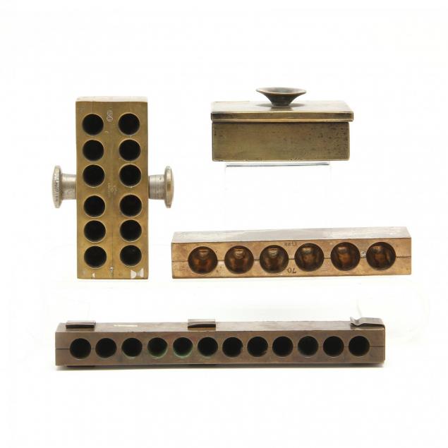 four-large-brass-suppository-molds