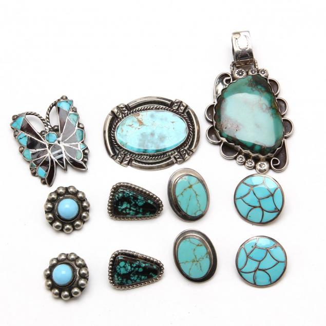 a-collection-of-silver-and-turquoise-jewelry