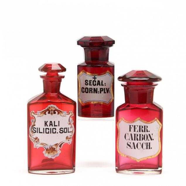 group-of-three-ruby-glass-apothecary-bottles