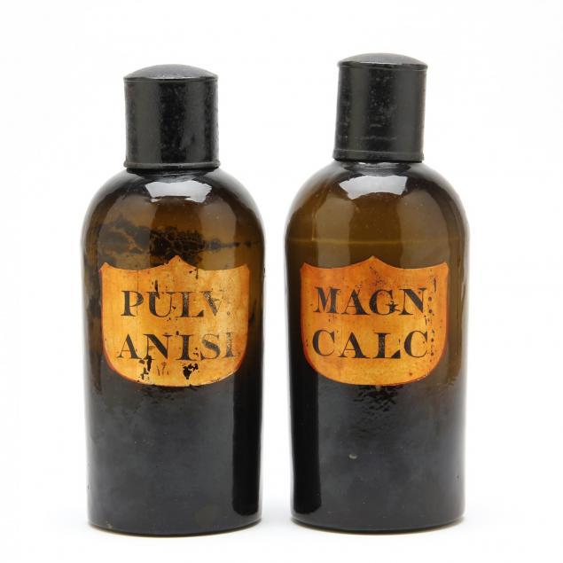 a-pair-of-dark-amber-apothecary-bottles