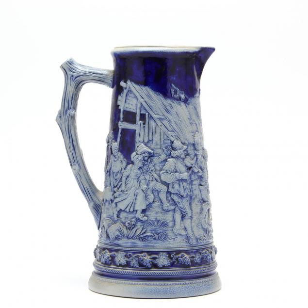 an-antique-german-cobalt-decorated-stoneware-pitcher-by-peter-simon-gerz