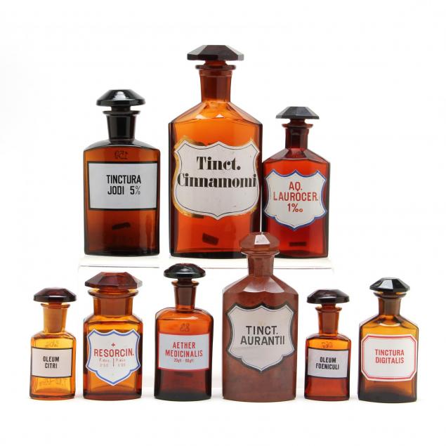 group-of-nine-similar-amber-glass-apothecary-bottles
