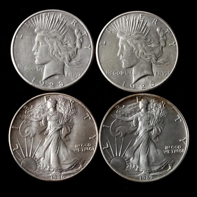two-peace-silver-dollars-and-two-silver-american-eagles