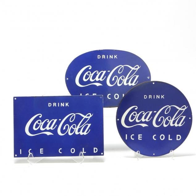 three-vintage-coca-cola-enameled-signs