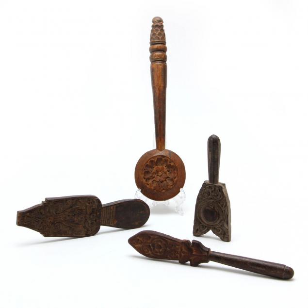 four-antique-southeast-asian-carved-wood-implements