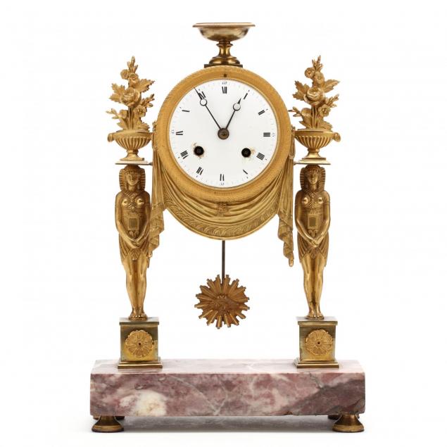 a-french-egyptian-revival-gilt-bronze-mantel-clock
