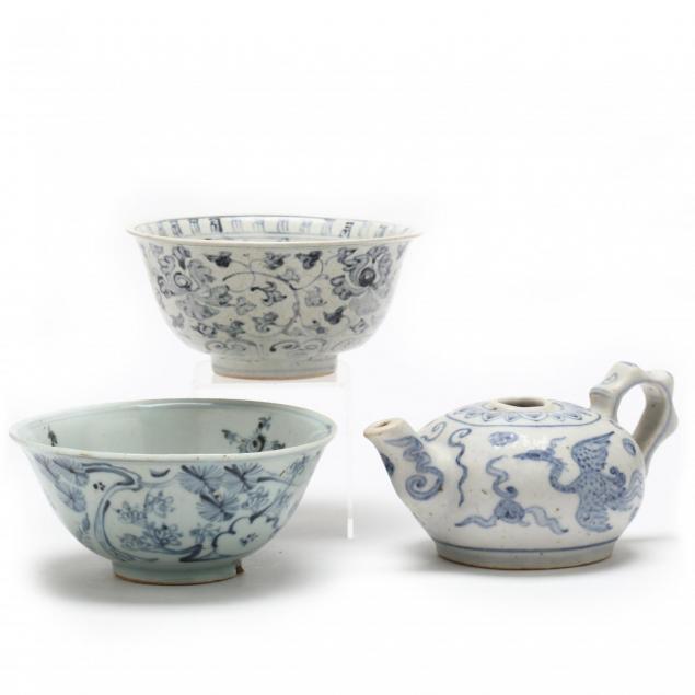 two-chinese-blue-and-white-bowls-and-teapot