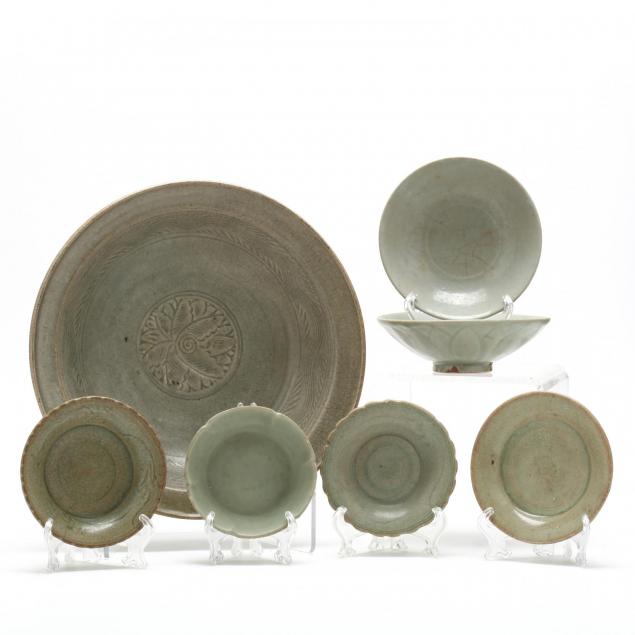 a-group-of-seven-asian-celadon-bowls-and-dishes
