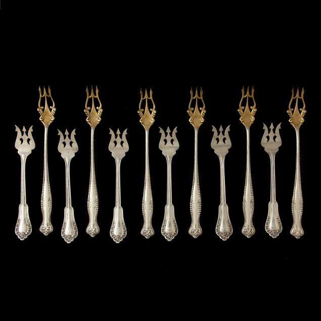 an-assembled-set-of-twelve-sterling-silver-seafood-cocktail-forks
