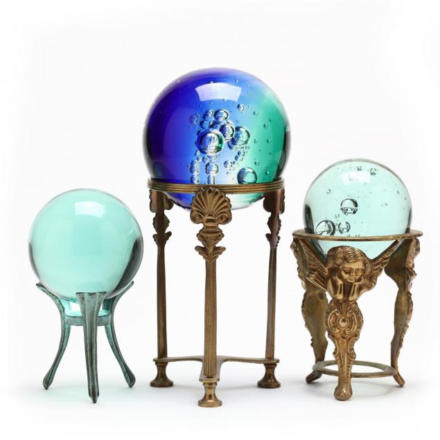 three-glass-gazing-balls-on-stands