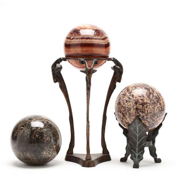 three-natural-rock-orbs-on-stands