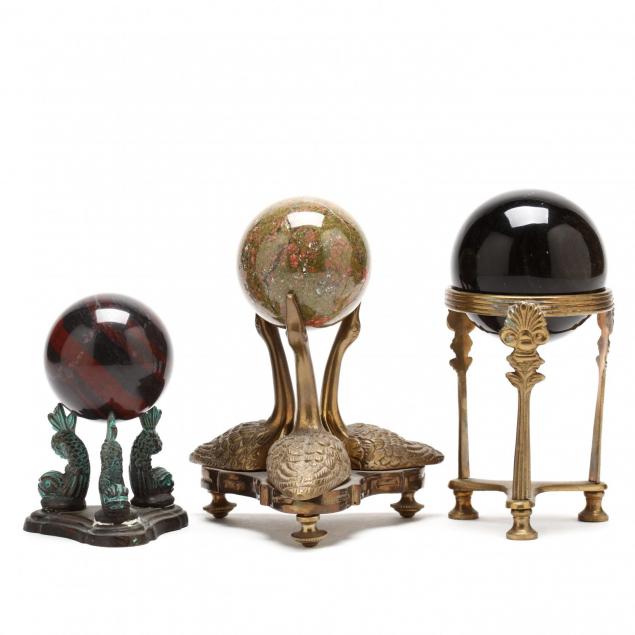 three-natural-rock-spheres-on-stands