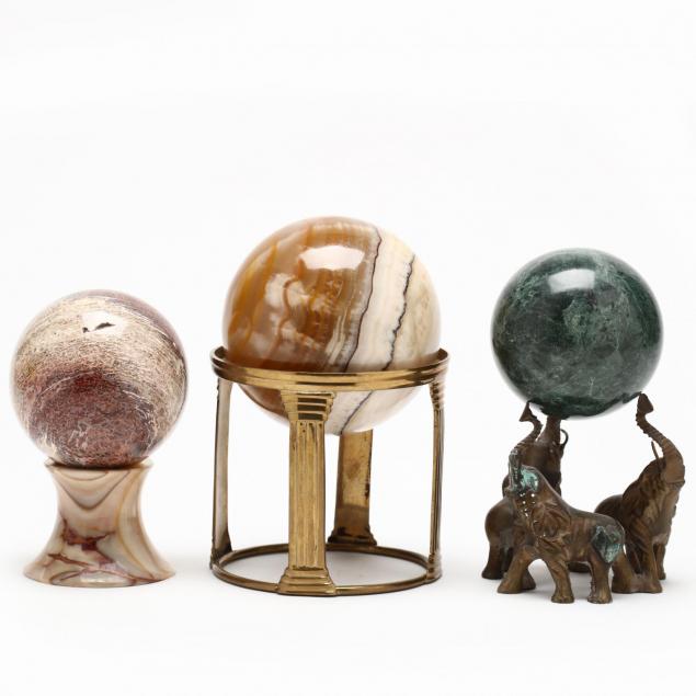 three-natural-rock-orbs-on-stands