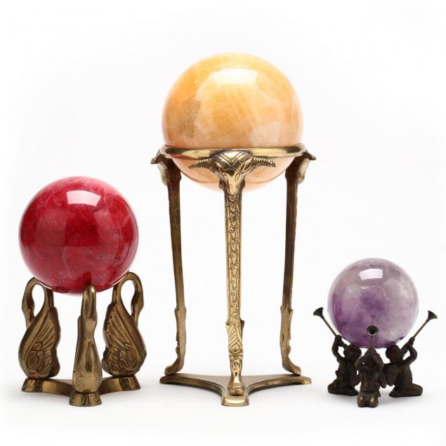 three-rock-orbs-on-stand