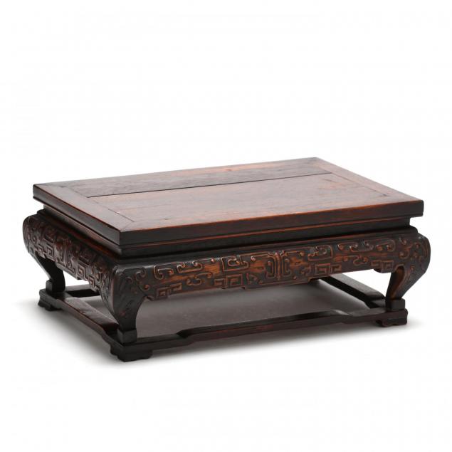 a-chinese-hardwood-raised-carved-stand