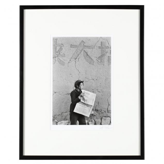 framed-photograph-picturing-a-figure-with-newspaper