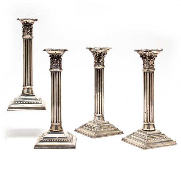 a-set-of-four-sterling-silver-corinthian-column-candlesticks