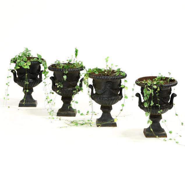 four-diminutive-cast-iron-urns