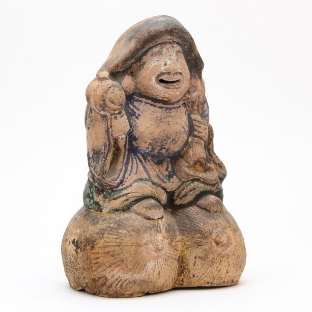 an-asian-pottery-figure
