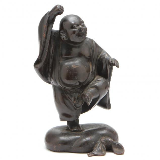 a-cast-iron-figure-of-standing-buddha