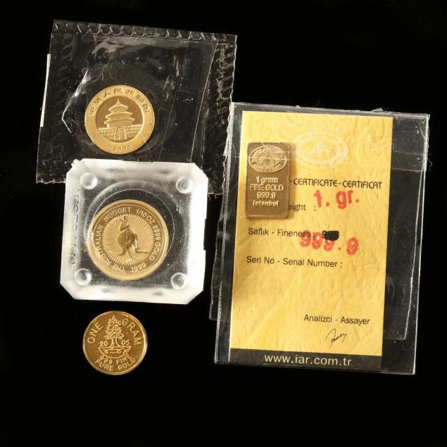 four-small-gold-numismatic-items