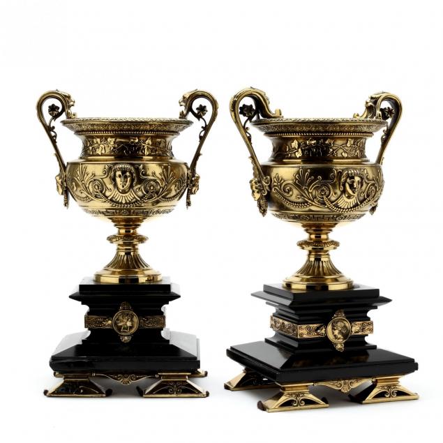 a-pair-of-classical-style-bronze-and-black-stone-campana-urns