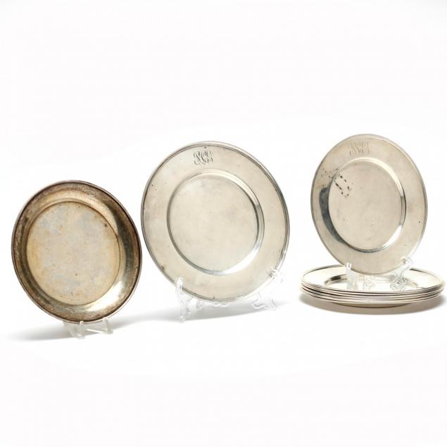 an-assembled-set-of-nine-sterling-silver-bread-plates